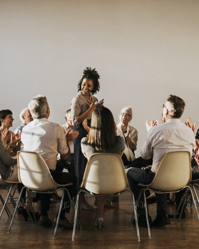 People sitting and talking with a group